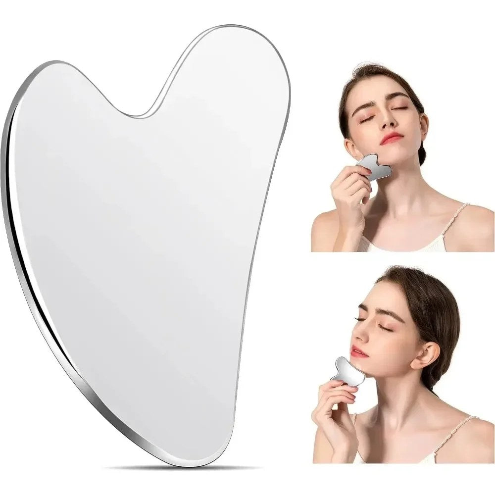 A woman demonstrates facial massage techniques using a heart-shaped stainless steel gua sha tool.