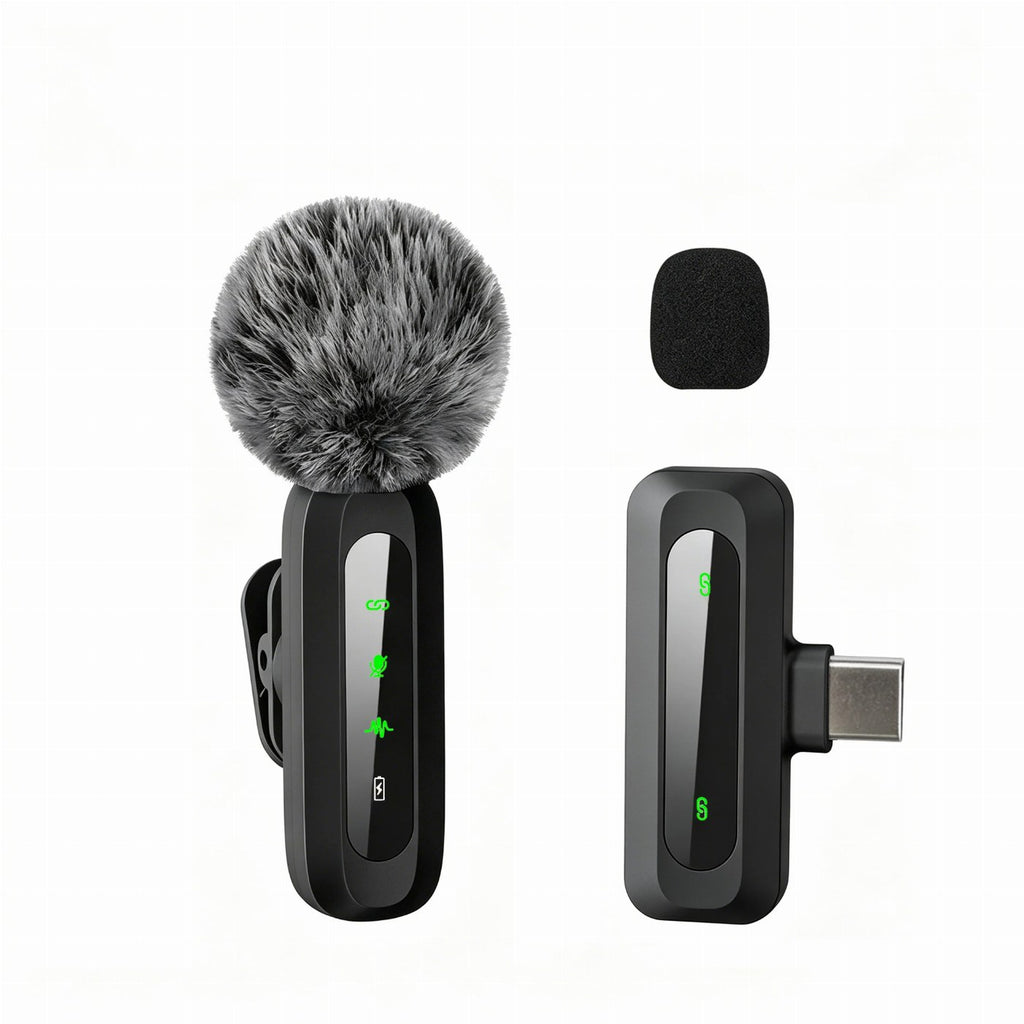 A wireless clip-on lavalier microphone with a fluffy deadcat windscreen sits next to its USB-C receiver and a small foam cover against a white background.
