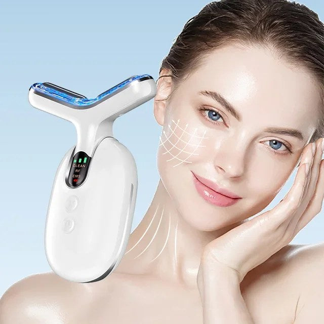 A woman holds a white and blue LED face and neck lifting massager device against a light blue background.
